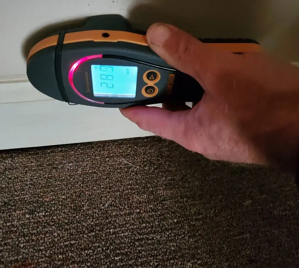 Moisture detection at baseboard during Burst Pipe Cleanup in Scott